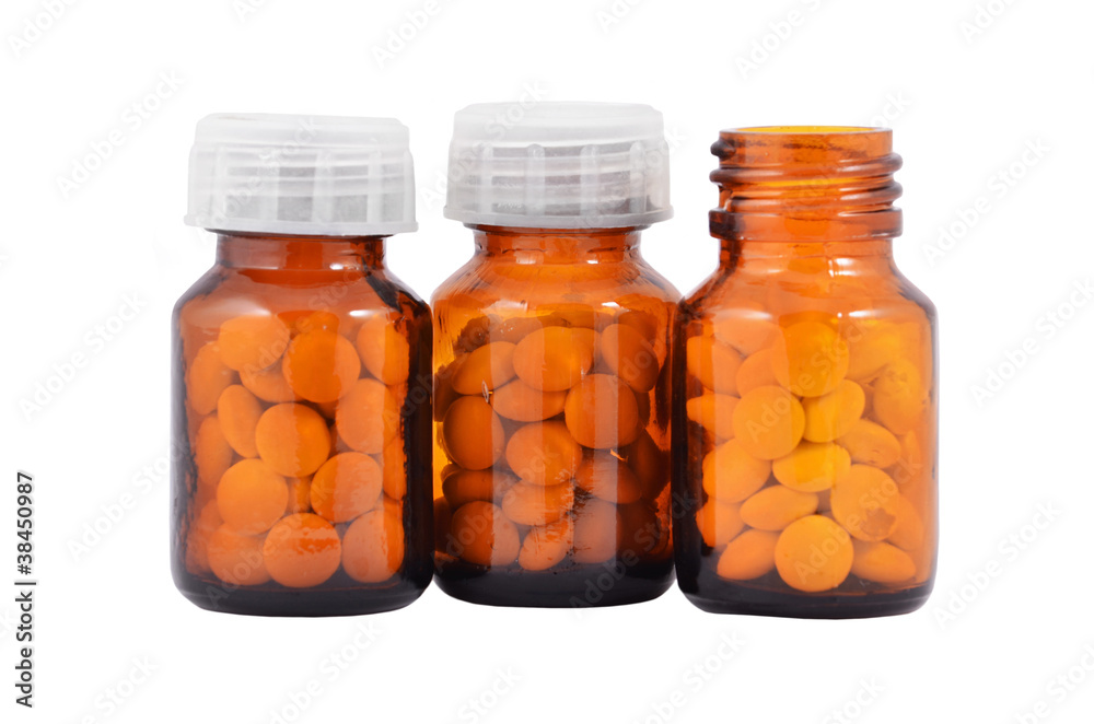 Pills in retro bottle, isolated on white background Pills in retro bottle, isolated on white background