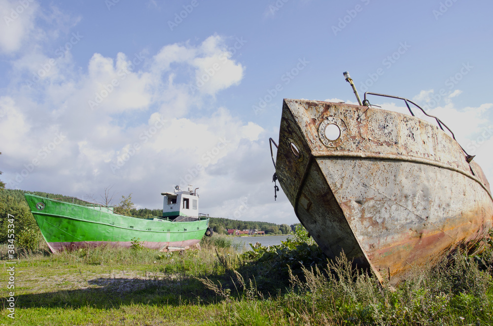 Fototapeta premium old boats on the sea coast