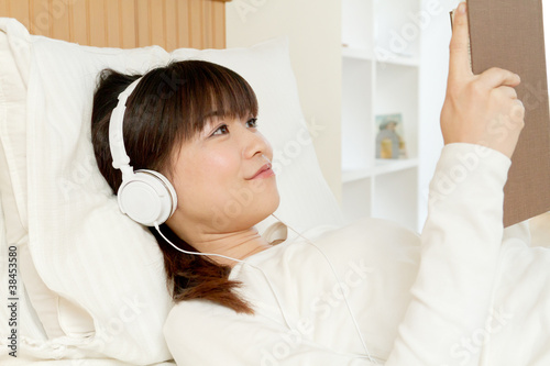 Beautiful young woman listening to music