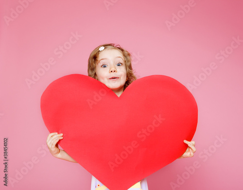 Girl holding paper heart