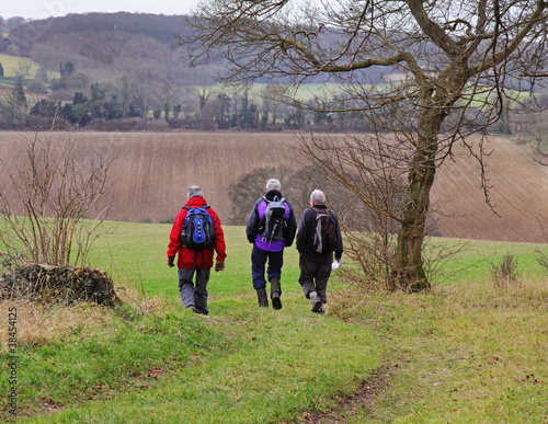 Three male Ramblers on an English Rural Trail