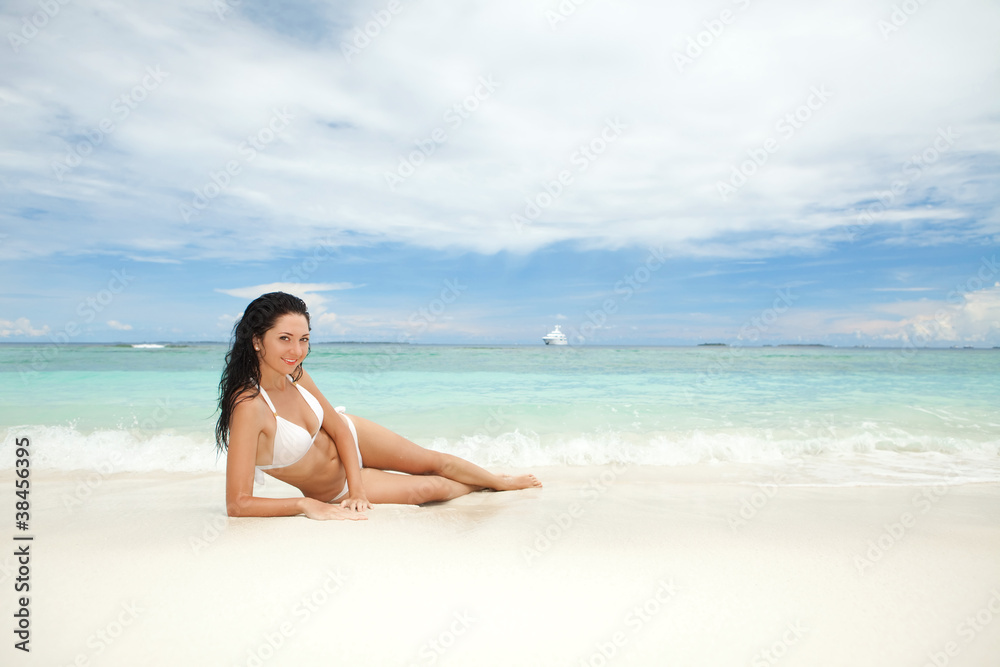 Happy young woman rest on the beach
