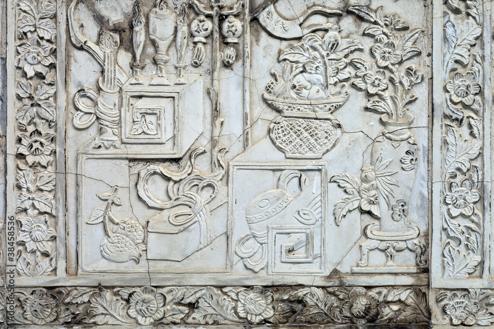 White stucco , thai style on the Wall