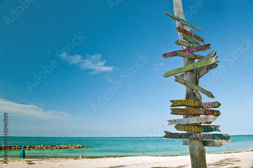 mileage milepost on beach in key west florida photo