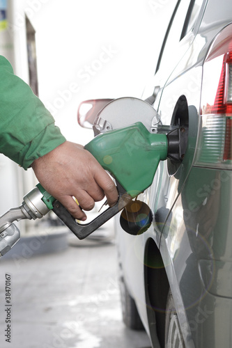 Refueling Automobile With Gasoline Pump Nozzle