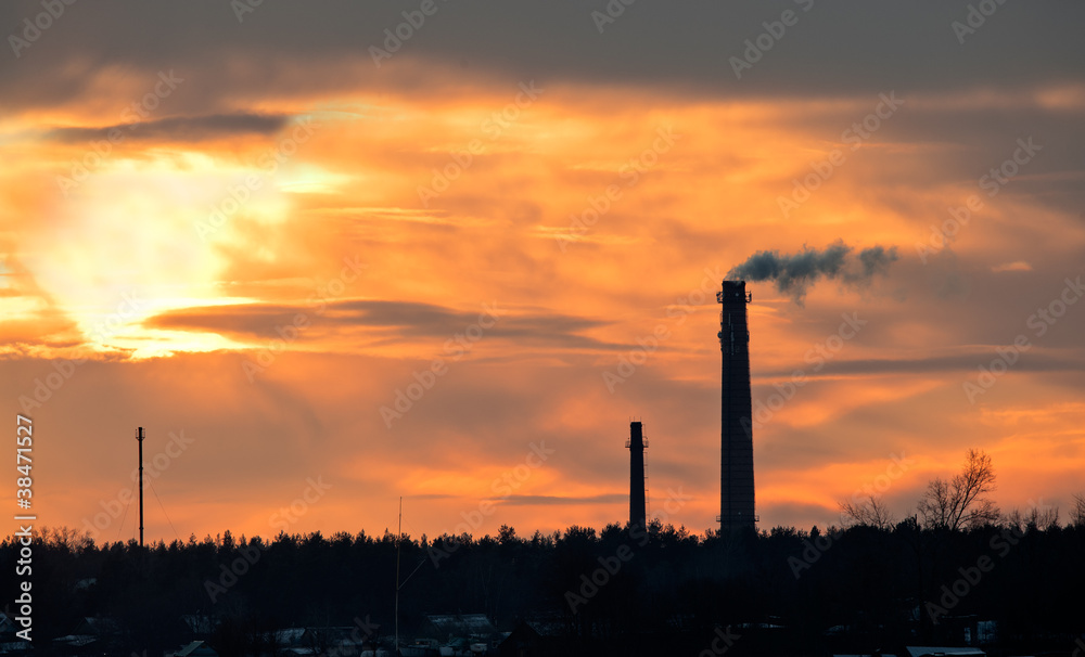 Smoking pipe against a sunset sky