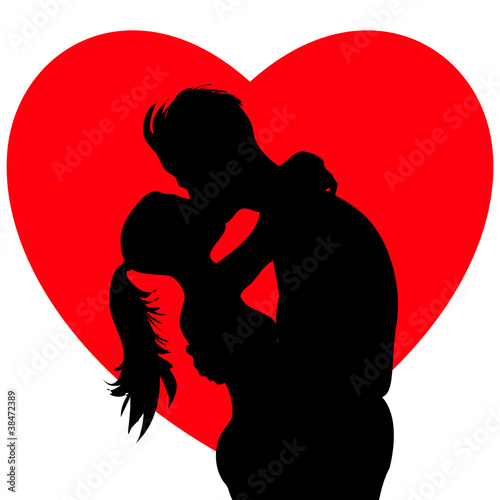 Young passionate kissing couple silhouettes