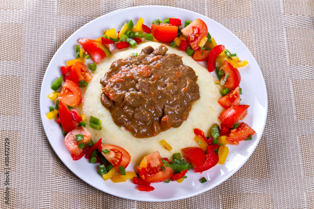 Beef goulash with potatoes and vegetables salad Beef goulash with potatoes and vegetables salad