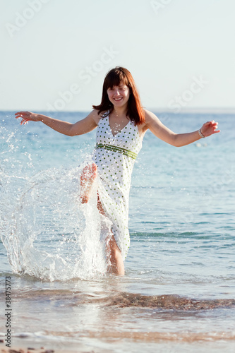 Happy woman on sea beach