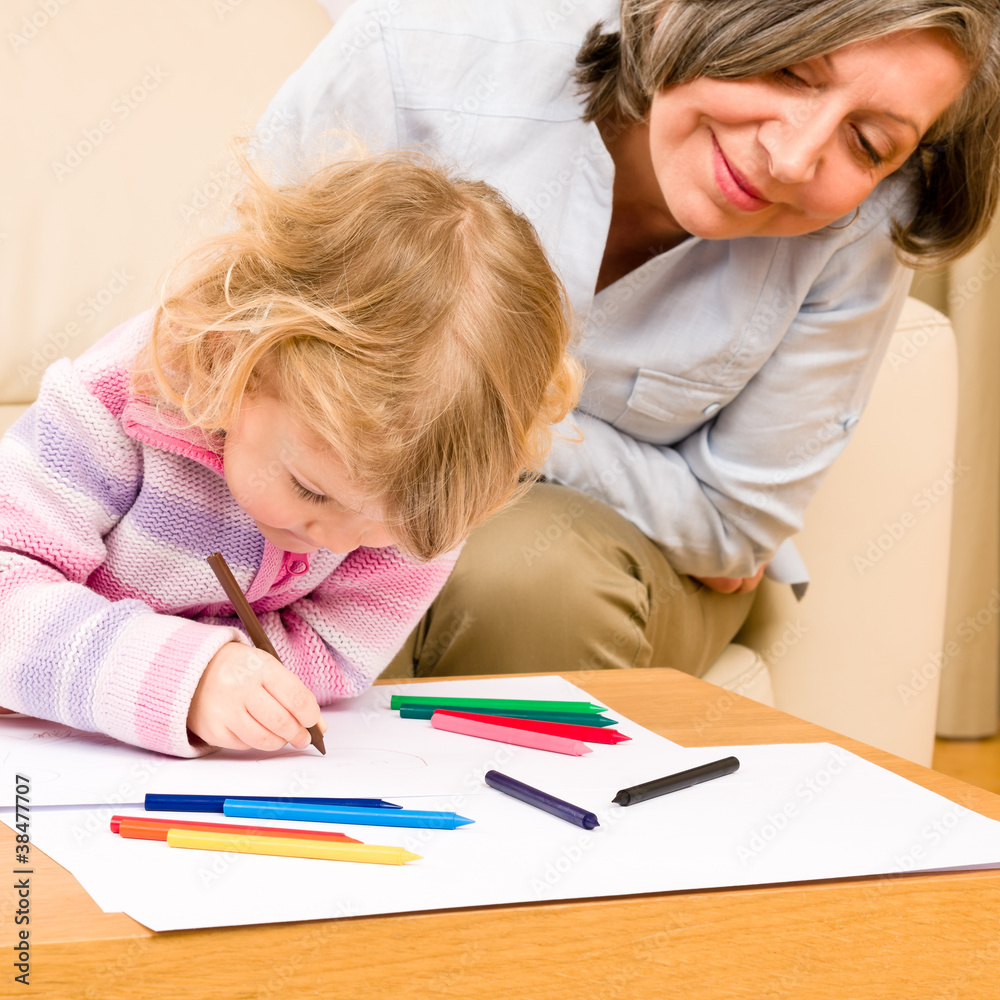Grandmother and granddaughter drawing at home Grandmother and granddaughter drawing at home