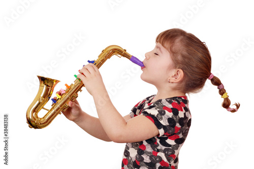 little girl play saxophone photo