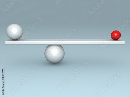 balance concept with two red and white balls on scales