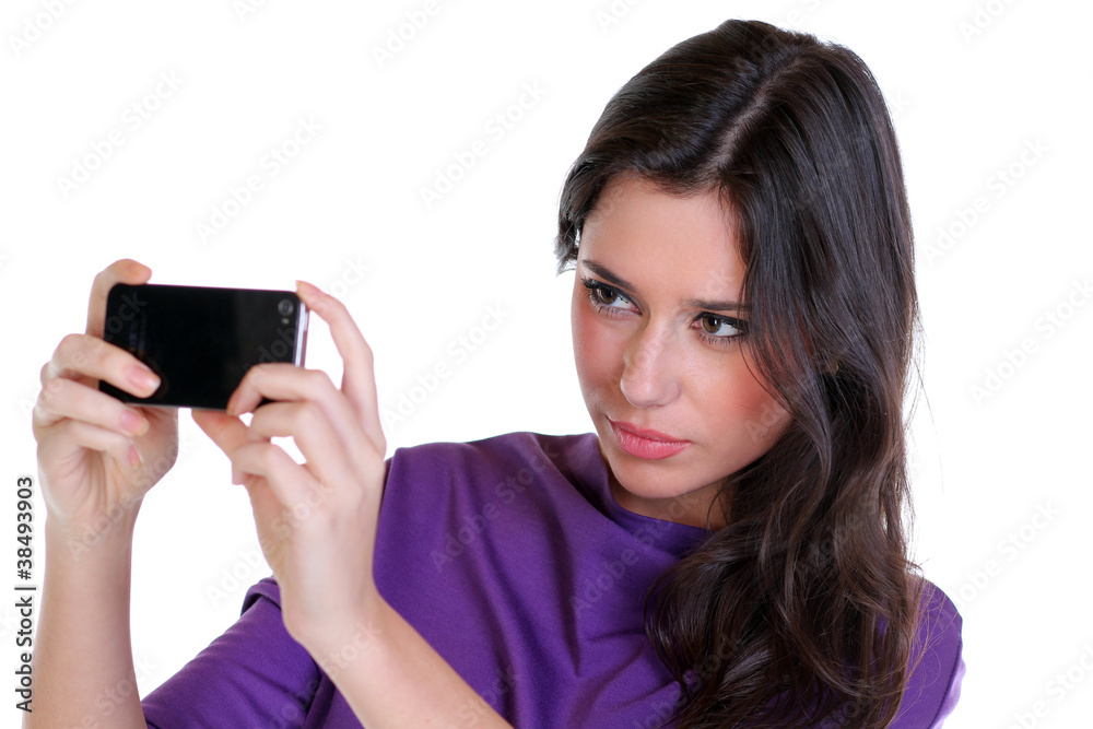 Girl posing for a photograph taken from his cell phone Girl posing for a photograph taken from his cell phone