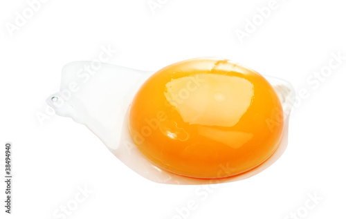 Egg yolk closeup isolated on white .