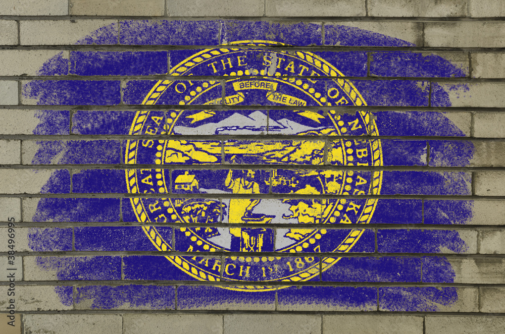 grunge flag of US state of nebraska on brick wall painted with c grunge flag of US state of nebraska on brick wall painted with c