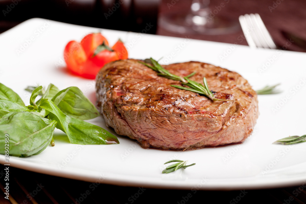 Grilled steak on a white plate Grilled steak on a white plate