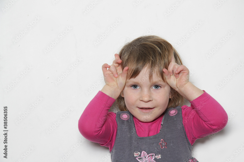 cute young girl making faces cute young girl making faces
