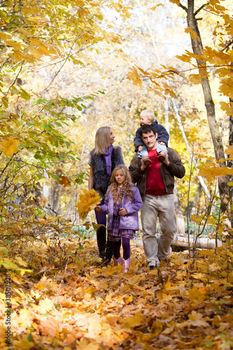 Family Enjoying Walk In Park