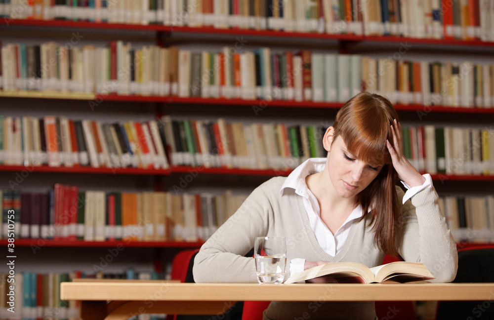 Young student in a library Young student in a library