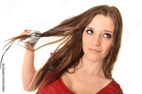 Portrait of young beautiful girl doing hairstyle photo
