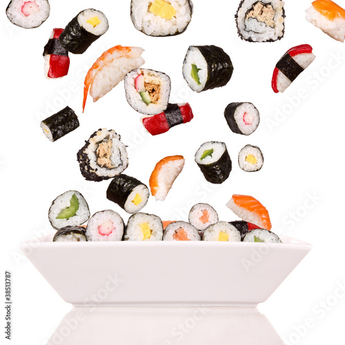 Delicious pieces of sushi, isolated on white background