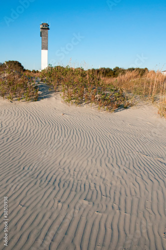 A Black and White Lighthouse on the Beach