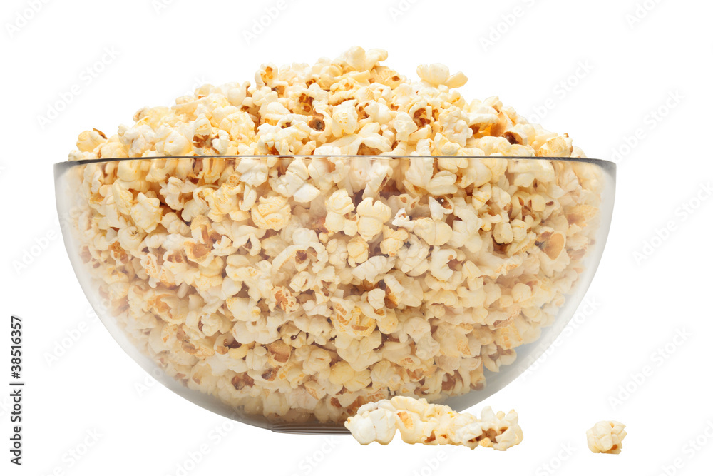 popcorn in glass bowl over white background popcorn in glass bowl over white background