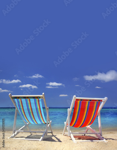 stripy chairs on the beach
