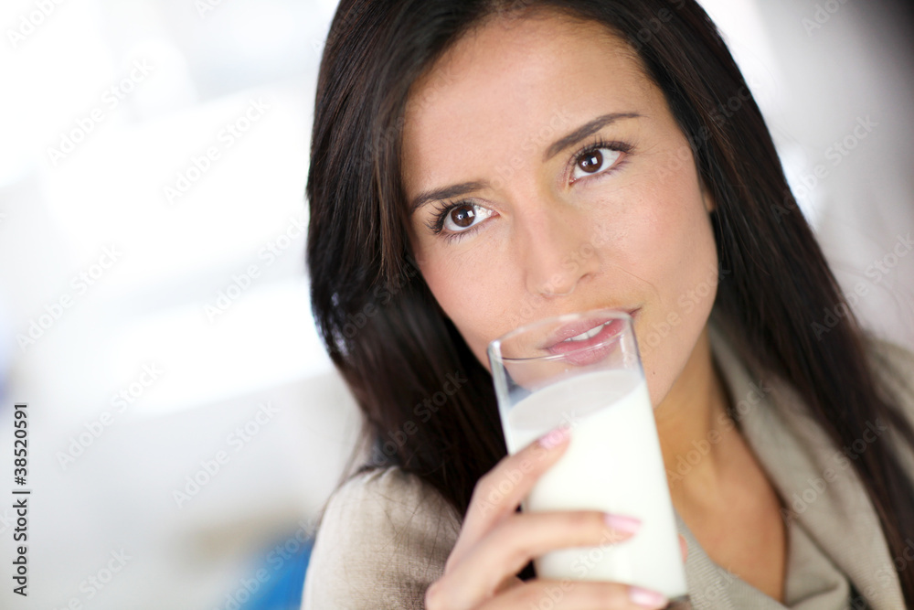 Attractive young woman drinking fresh milk Attractive young woman drinking fresh milk