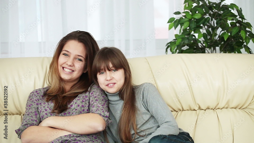Sisters sitting on the couch Sisters sitting on the couch