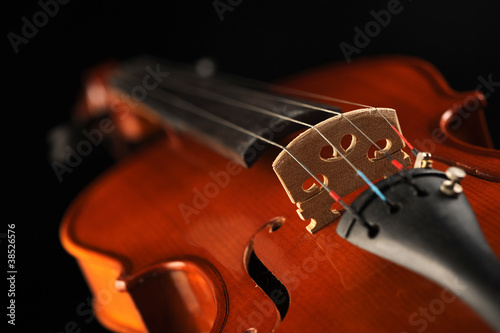 close up shot of a violin, shallow deep of field