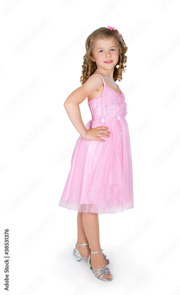 The girl in a pink dress on a white background