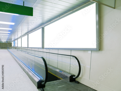 Blank billboard in underground passage photo