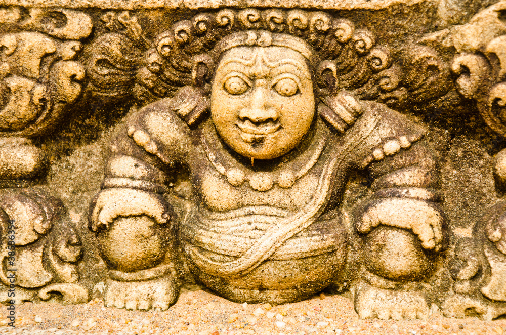 Fototapeta premium stone statues that support the arch of steps, leading to a holy