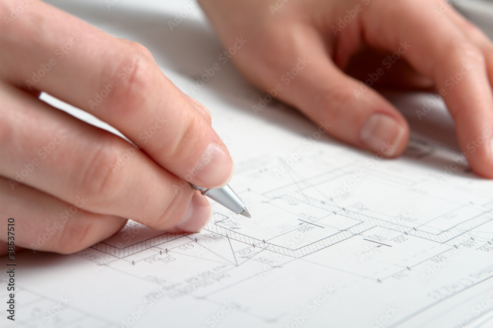 Construction Plan with woman hands