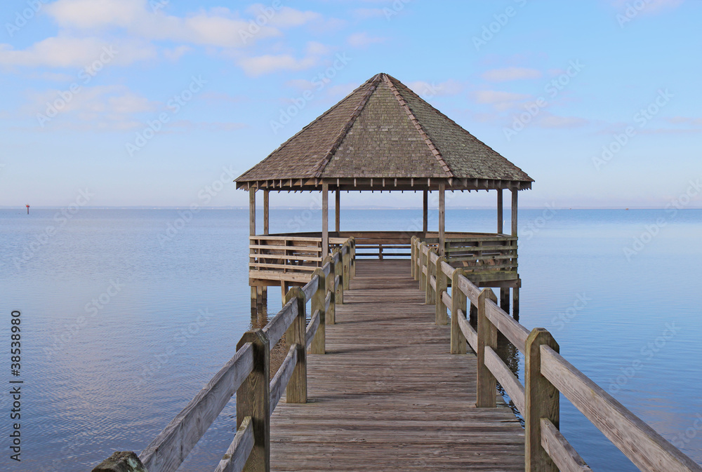Gazebo and dock over calm sound waters
