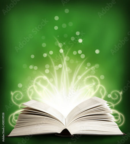 The open Magic Book with sparklings. green