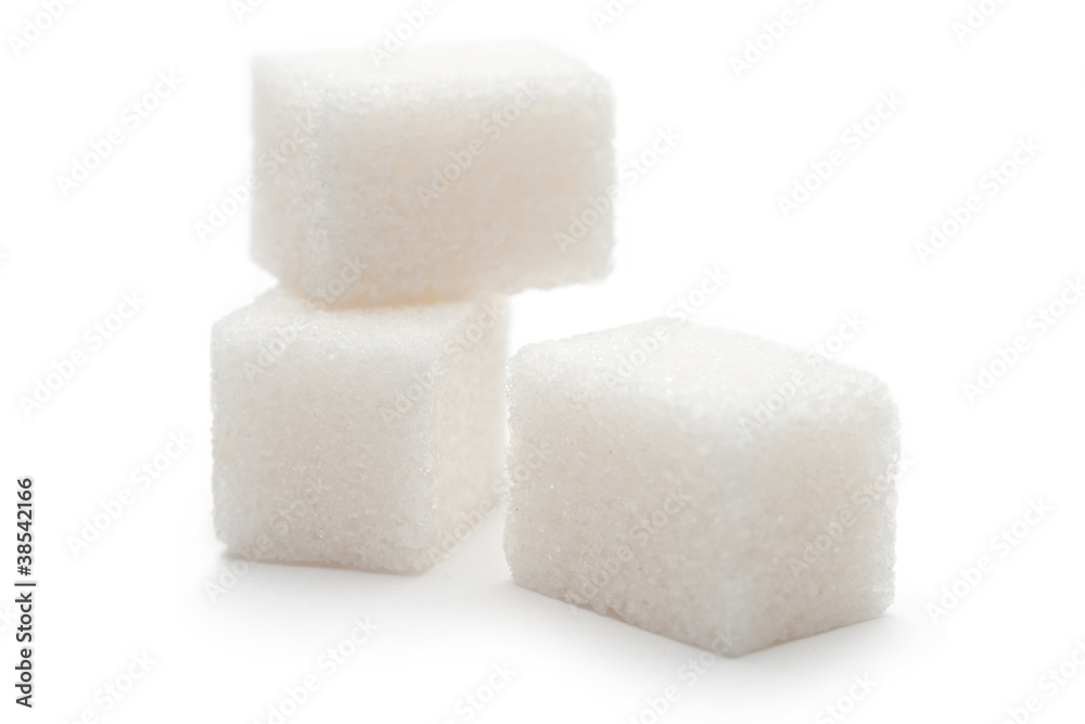 Cubes of sugar on the white background Cubes of sugar on the white background