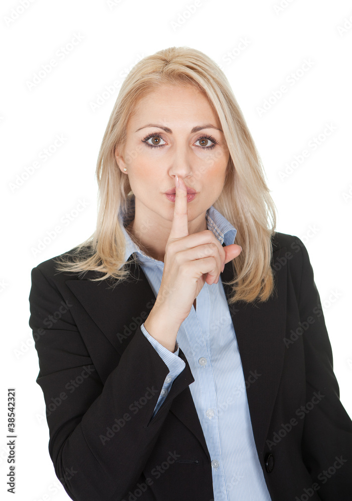 Beautiful business woman making a silence gesture Beautiful business woman making a silence gesture