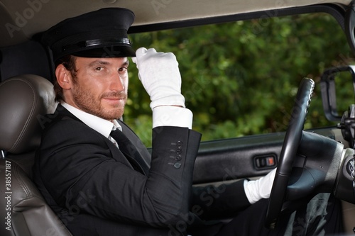 Obraz na płótnie Confident chauffeur in elegant automobile