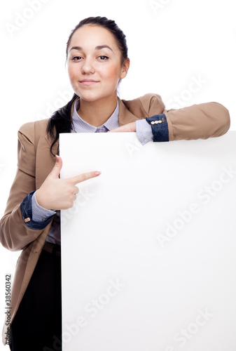 Young businesswoman with blank board