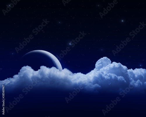 Fototapeta Moon behind clouds