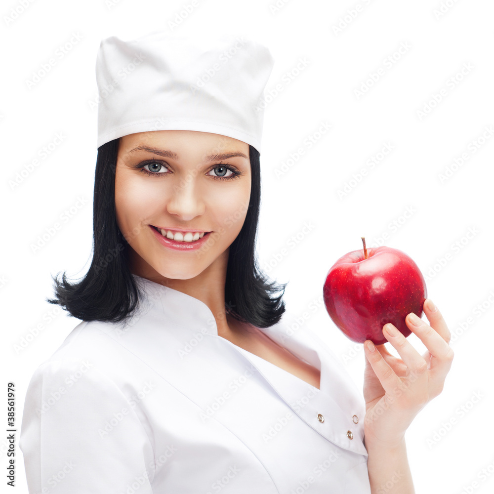 A female medical doctor holding a red apple isolated on white ba A female medical doctor holding a red apple isolated on white ba