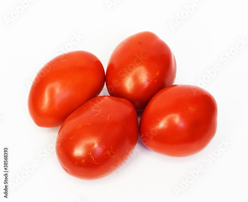 Four ripe tomatoes isolated on white background