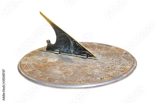 old copper sundial isolated on white background photo