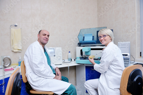 veterinarian and assistant in a small animal clinic