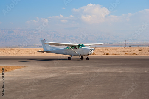 White Cessna-172 plane on the desert aerodrome