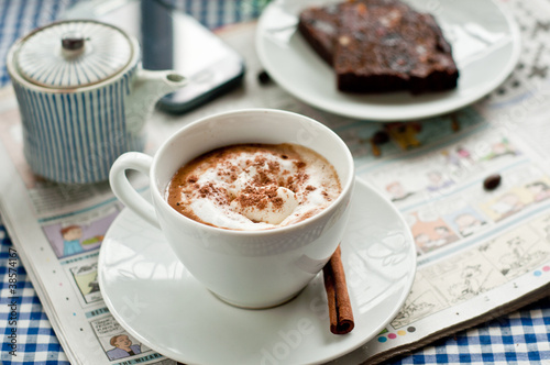 Cappuccino for Breakfast with newspaper and blue tea towel 1