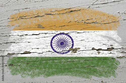 flag of india on grunge wooden texture precise painted with chal