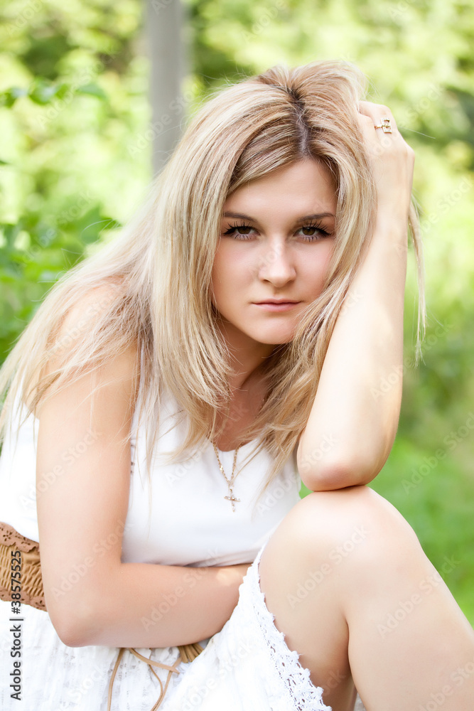Young cute girl resting in fresh spring grass Young cute girl resting in fresh spring grass